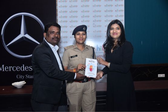 Shilpi Goel giving her book to DGP, Raipur at healthy recipe workshop with Mercedes at Mayfair, Raipur