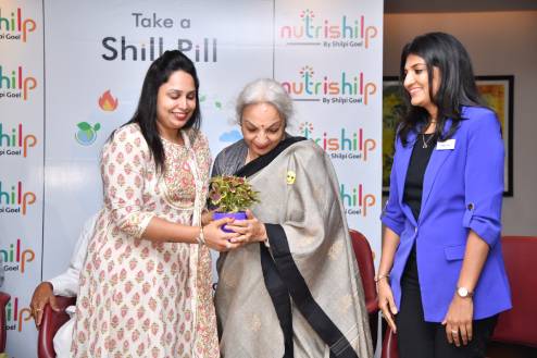 Shilpi Goel and Megha Goel presenting gift to Mrs. Kalpana Chaudhary during book launch event of 'Take a Shill Pill'